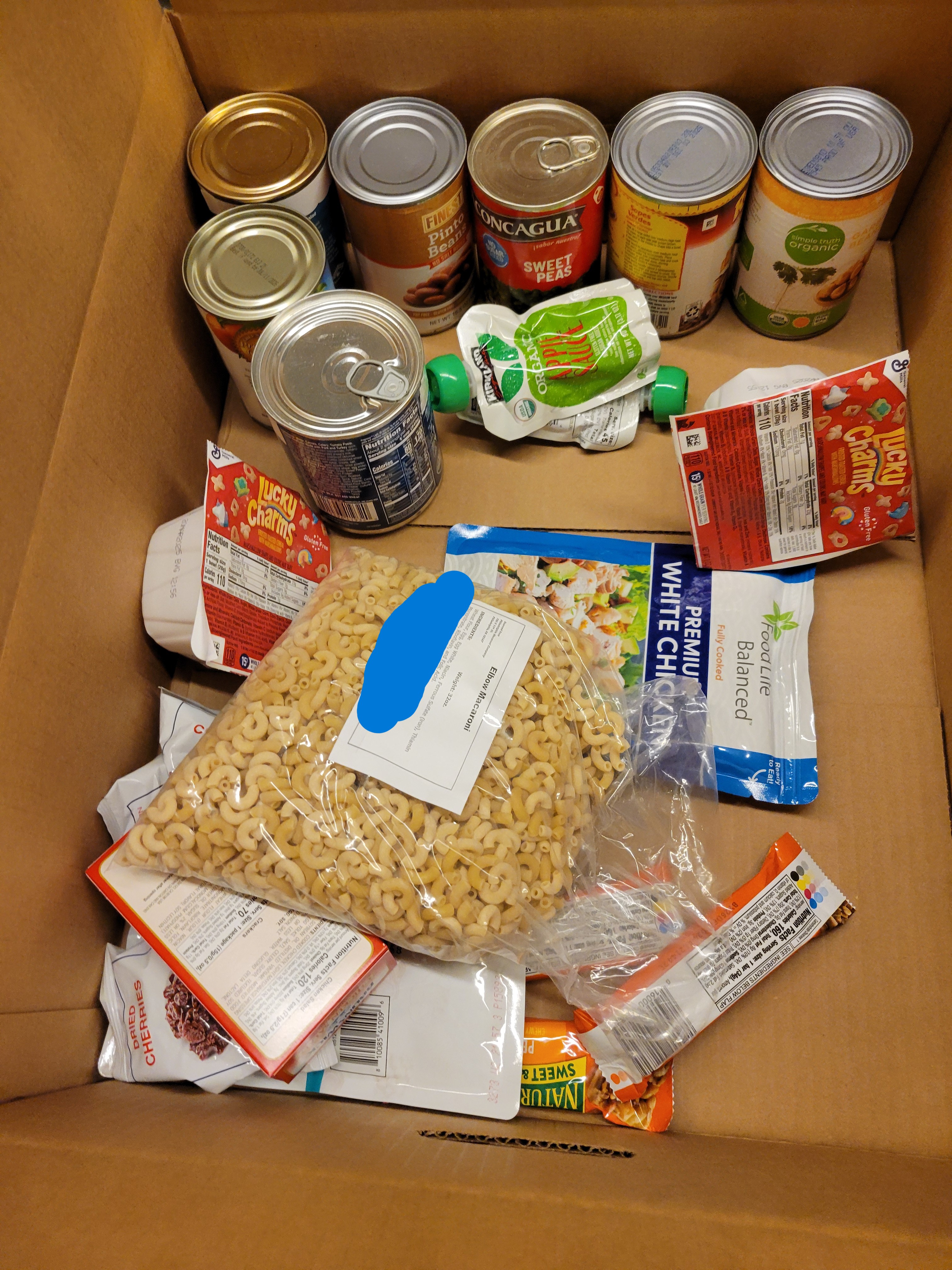 Cardboard box filled with dry goods.